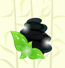 Image showing Meditative bamboo background with cairn stones and eco green lea