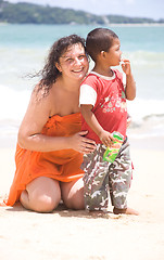 Image showing Russian woman hugs a Thai child