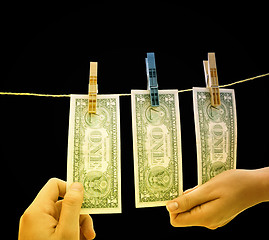 Image showing Dollars on the wire