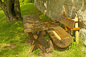 Image showing park bench at an old antique abbey wall