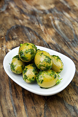 Image showing green olives with fresh bread and herbs