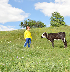 Image showing The Child and calf