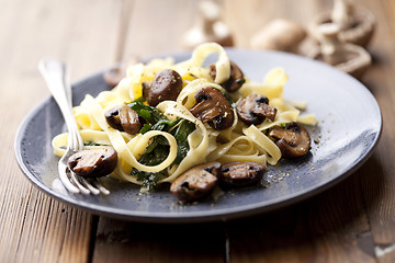 Image showing tagliatelles with spinach and mushrooms