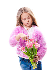 Image showing beautiful  little girl with bouquet of pink tulips isolated on white