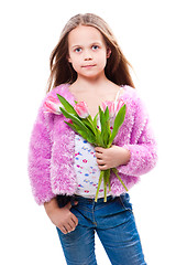 Image showing beautiful  little girl with bouquet of pink tulips isolated on white