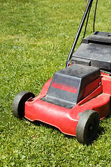 Image showing lawnmower on green grass