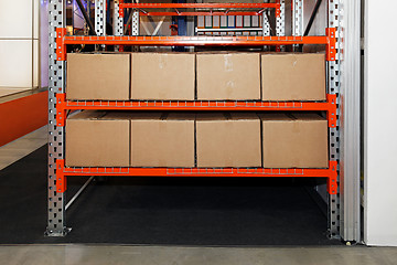 Image showing Boxes in shelf