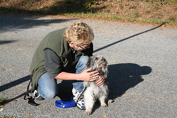 Image showing Dog with the owner