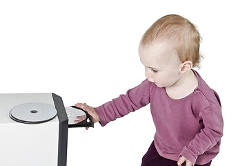 Image showing young child playing with CD