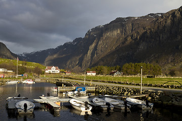 Image showing small harbor with mountains in background