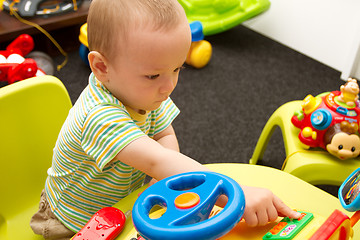 Image showing Baby Playing With The Toys