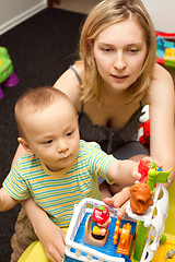 Image showing Baby And Mother Playing With The Toys