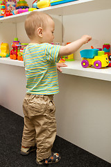 Image showing Baby Playing With The Toys