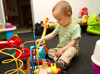 Image showing Baby Playing With The Toys