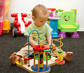 Image showing Baby Playing With The Toys