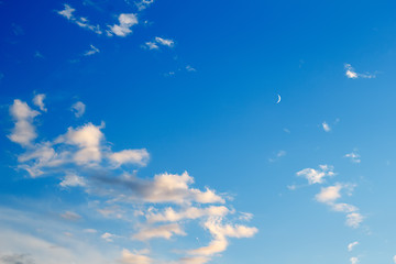 Image showing beautiful sunset clouds with the moon