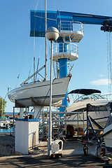 Image showing crane in yachts service and shipyard in port