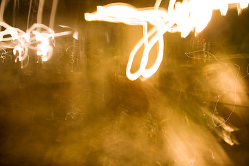 Image showing Chaotic forms with the fire of cigarettes in a dark room
