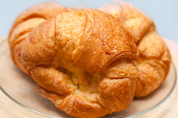Image showing fresh baked french croissant brioche on wood board