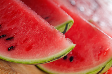 Image showing fresh watermelon on a  wood table