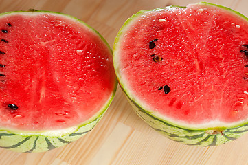 Image showing fresh watermelon on a  wood table