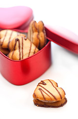 Image showing heart shaped cream cookies on red heart metal box