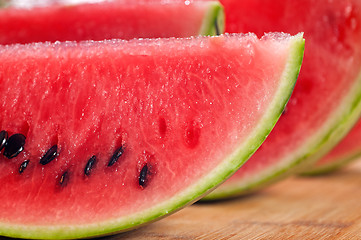 Image showing fresh watermelon on a  wood table