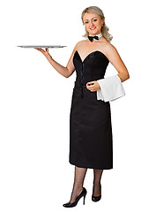 Image showing Young woman waiter with a tray on white