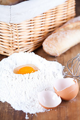 Image showing still life of bread, flour, eggs 
