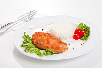 Image showing  meat with mixed leaf salad an rice on white