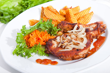 Image showing steak served with sauteed onions, salad and baked potato