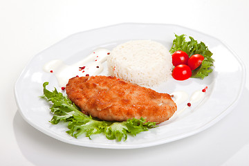 Image showing  meat with mixed leaf salad an rice on white