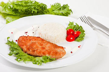 Image showing  meat with mixed leaf salad an rice on white