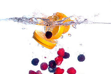 Image showing Fresh Fruit Falls under Water with a Splash