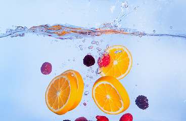 Image showing Fresh Fruit Falls under Water with a Splash