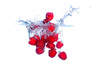 Image showing Red Raspberries Falls under Water with a Splash