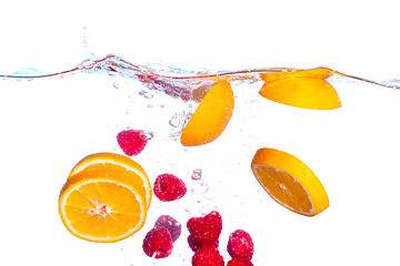 Image showing Fresh Fruit Falls under Water with a Splash