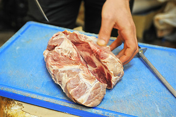 Image showing cutting meat