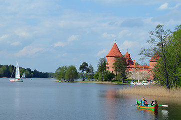 Image showing People travel boat on lake Galve and Trakai Castle 