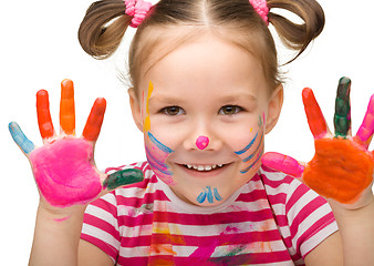 Image showing Portrait of a cute girl with painted hands