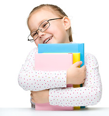 Image showing Cute little girl with books