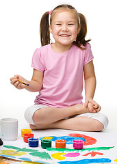 Image showing Cute cheerful child play with paints