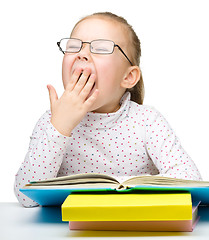 Image showing Cute little girl reading book