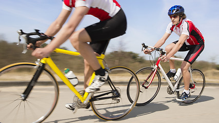 Image showing Cyclists Riding On Country road