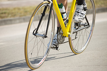 Image showing Male Athlete Riding Bicycle