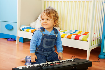 Image showing Boy playing a composer