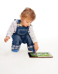 Image showing young kid touching tablet pc