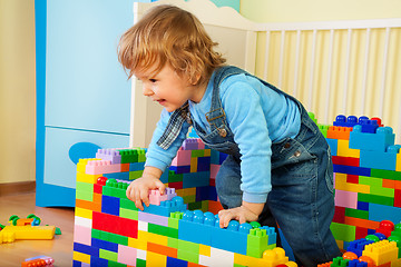 Image showing Happy kid claiming out of toy block