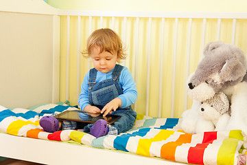 Image showing Boy playing with tablet pc