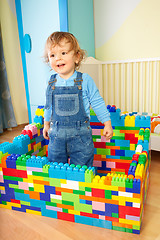 Image showing Kid playing with toy blocs